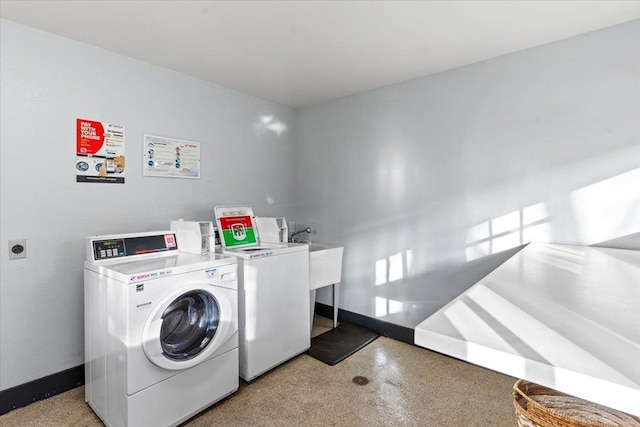 laundry room with separate washer and dryer