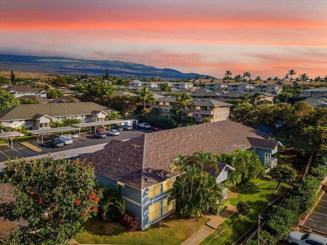 aerial view at dusk featuring a mountain view