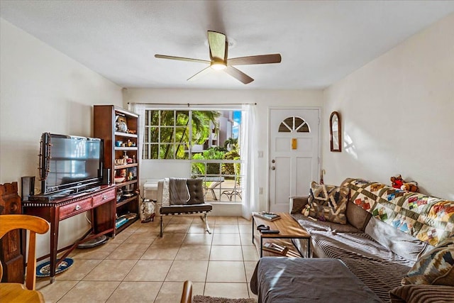 tiled living room featuring ceiling fan