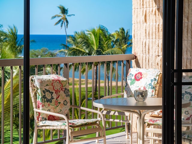 balcony featuring a water view