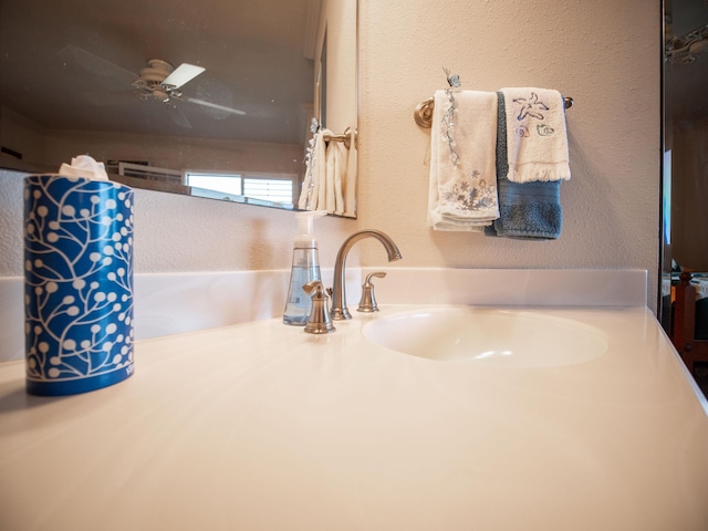 bathroom featuring ceiling fan and sink