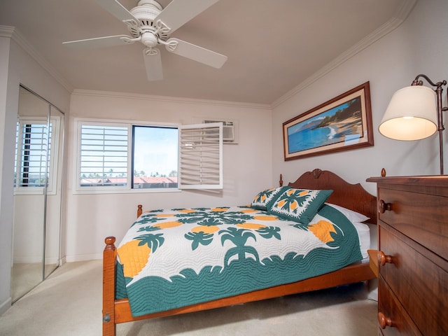 bedroom with ceiling fan, a closet, crown molding, and carpet flooring