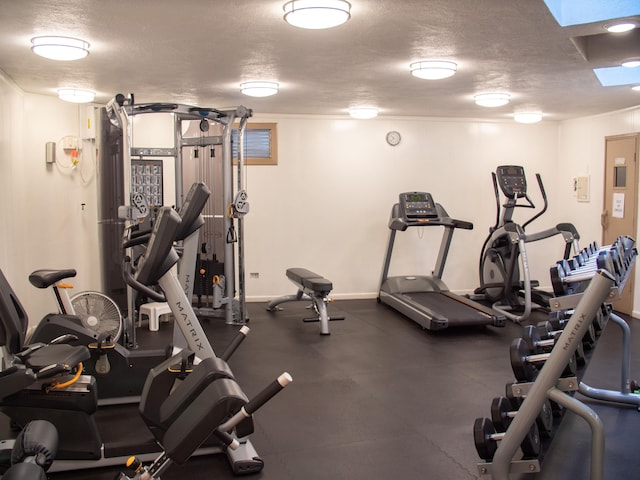 workout area with a textured ceiling