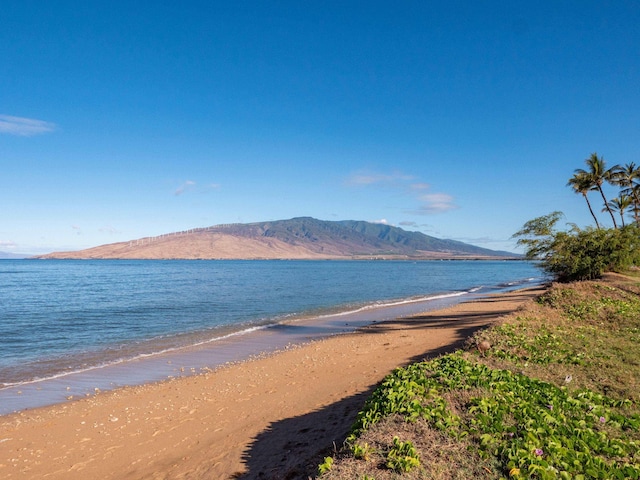 water view featuring a mountain view and a view of the beach