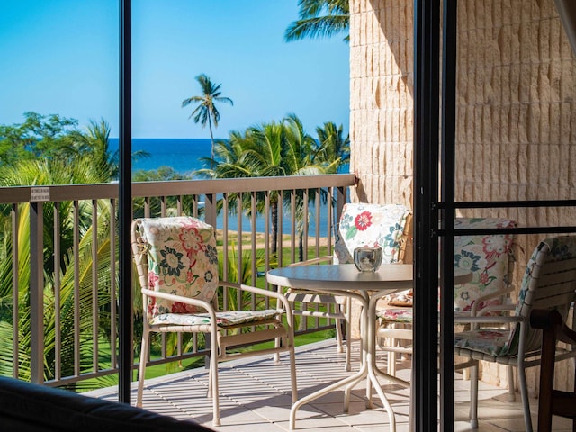 balcony featuring a water view