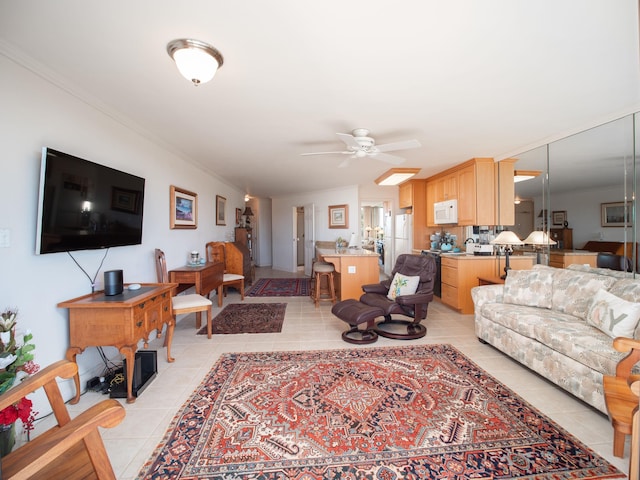 tiled living room featuring ceiling fan and crown molding