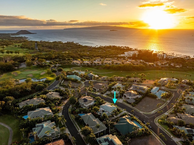 aerial view at dusk with a water view