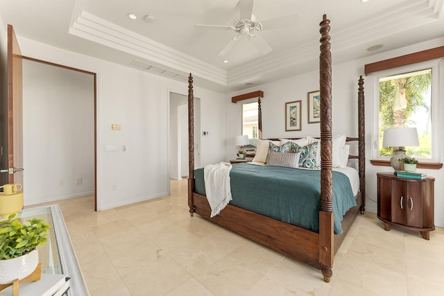 bedroom featuring a raised ceiling, ceiling fan, and crown molding