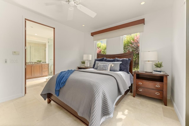 bedroom with ceiling fan, light tile patterned flooring, sink, and connected bathroom