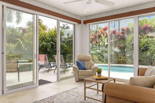 sunroom with ceiling fan and a wealth of natural light