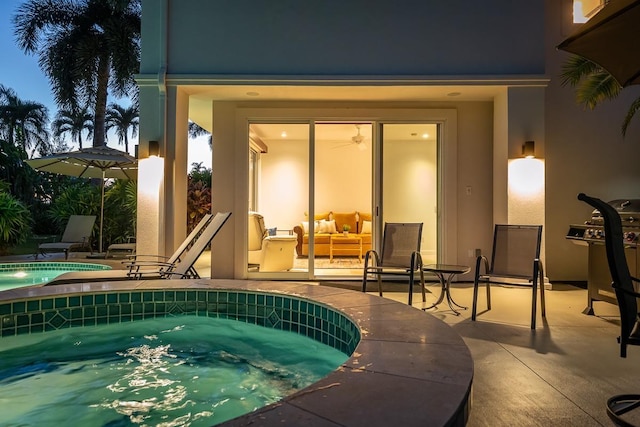 view of pool featuring an in ground hot tub and a patio