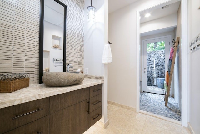 bathroom with vanity and tile patterned flooring