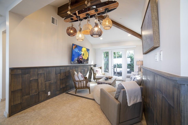 living room with lofted ceiling with beams