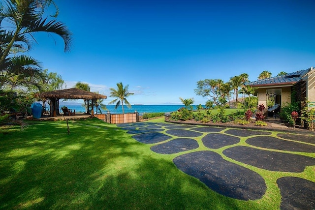 view of yard featuring a water view and a gazebo