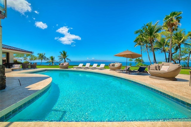 view of pool with outdoor lounge area and a patio