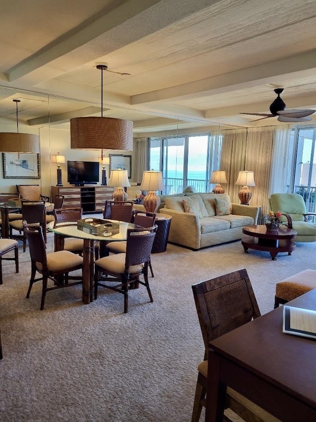 dining room with ceiling fan, plenty of natural light, and light carpet