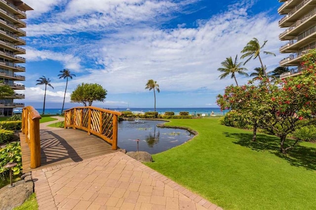 view of nearby features with a lawn and a water view