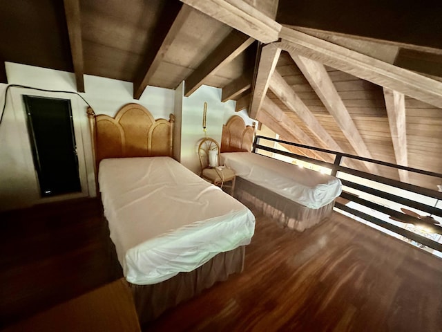 interior space with dark wood-type flooring, lofted ceiling with beams, and wooden ceiling