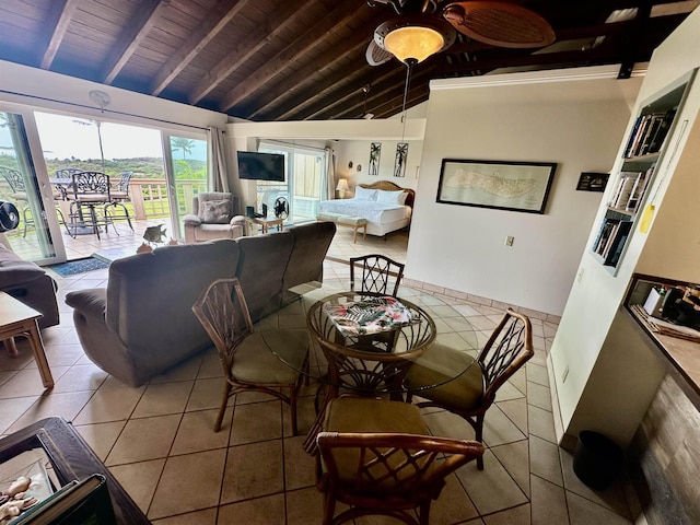 dining room featuring lofted ceiling with beams, light tile patterned flooring, and wood ceiling