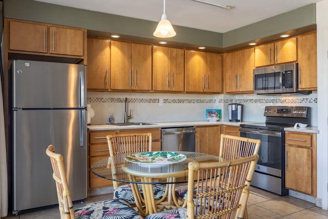 2653 S Kihei Rd Unit 114, Kihei, HI 96753 - kitchen featuring stainless steel appliances, light countertops, backsplash, brown cabinets, and recessed lighting