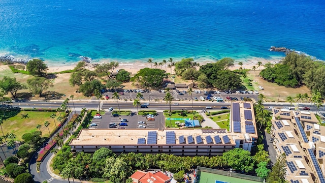 birds eye view of property with a water view and a view of the beach