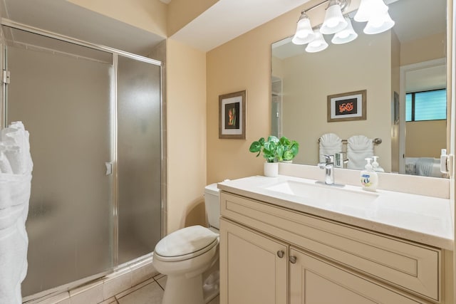 bathroom with walk in shower, tile patterned flooring, vanity, and toilet