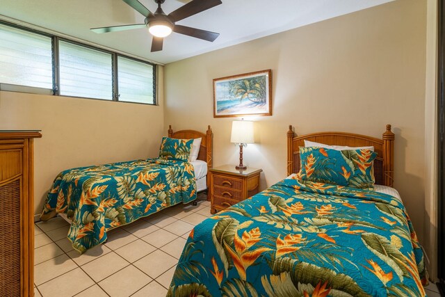 2653 S Kihei Rd Unit 114, Kihei, HI 96753 - bedroom featuring light tile patterned floors and a ceiling fan