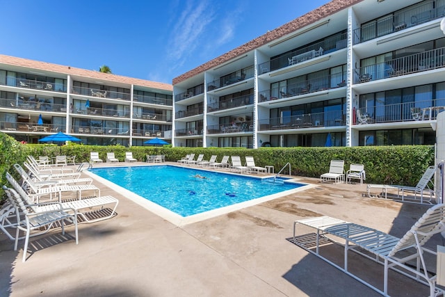 view of swimming pool featuring a patio