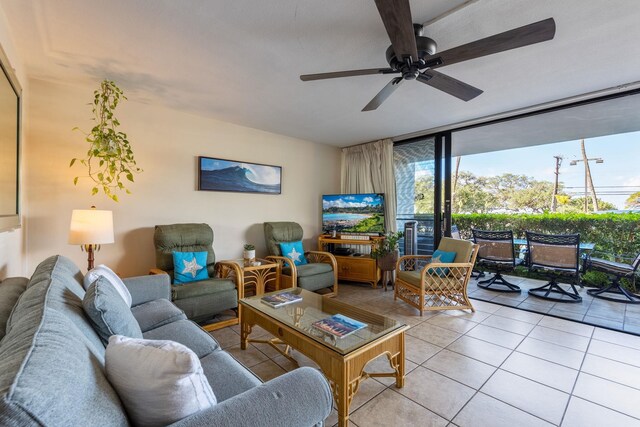 2653 S Kihei Rd Unit 114, Kihei, HI 96753 - living room with light tile patterned floors, ceiling fan, and a wall of windows