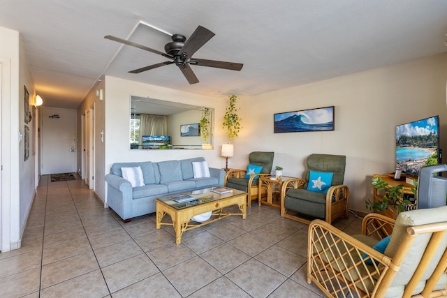 living room with tile patterned flooring and ceiling fan