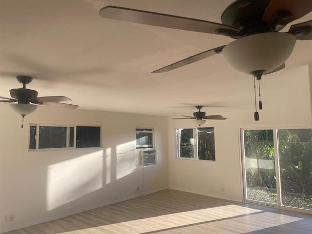 empty room featuring ceiling fan and wood finished floors