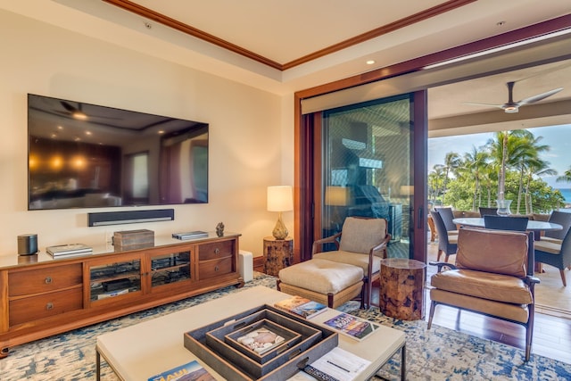 living room featuring ceiling fan, wood finished floors, and ornamental molding