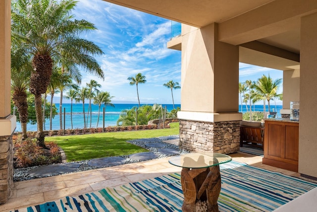 view of patio with a water view