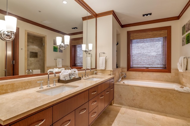 full bath featuring ornamental molding, a stall shower, a garden tub, and a sink