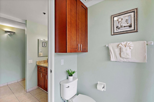 bathroom featuring tile patterned floors, vanity, and toilet