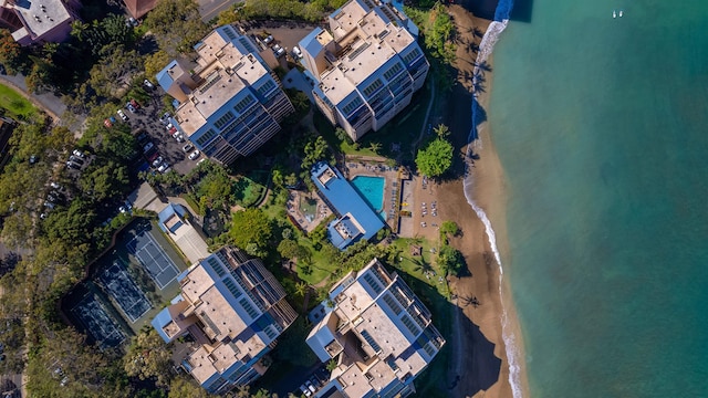 drone / aerial view with a water view and a view of the beach