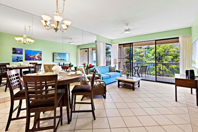 dining room with plenty of natural light, light tile patterned flooring, and ceiling fan with notable chandelier