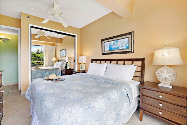 tiled bedroom with ceiling fan and a closet