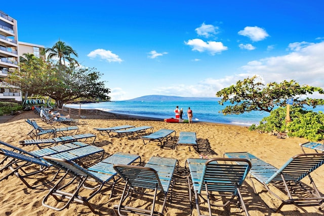 exterior space featuring a view of the beach and a water view