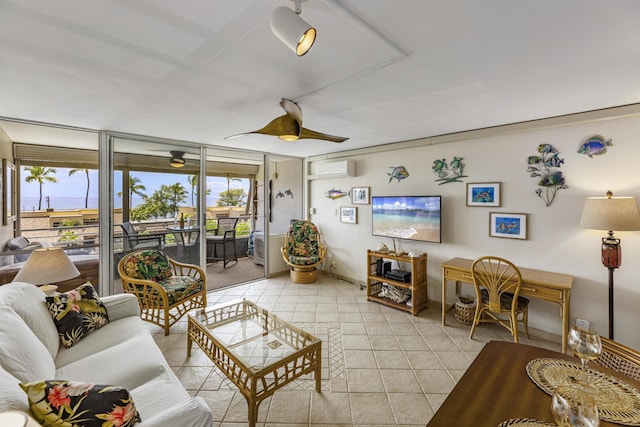 2385 S Kihei Rd Unit 306, Kihei, HI 96753 - living room featuring plenty of natural light, ceiling fan, and a wall mounted AC