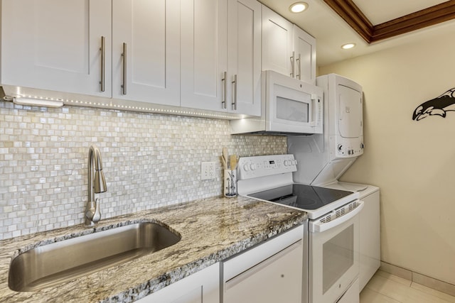 2385 S Kihei Rd Unit 306, Kihei, HI 96753 - kitchen with white appliances, a sink, white cabinets, light stone counters, and light tile patterned flooring