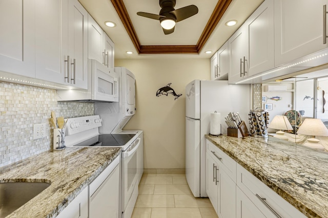 2385 S Kihei Rd Unit 306, Kihei, HI 96753 - kitchen featuring white appliances, a raised ceiling, decorative backsplash, baseboards, and recessed lighting