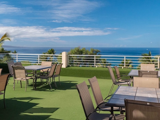 2385 S Kihei Rd Unit 306, Kihei, HI 96753 - view of patio with outdoor dining area, a water view, and a balcony