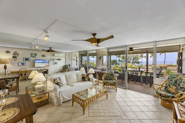 2385 S Kihei Rd Unit 306, Kihei, HI 96753 - living room with a ceiling fan and light tile patterned floors