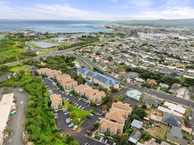 drone / aerial view featuring a water view and a residential view