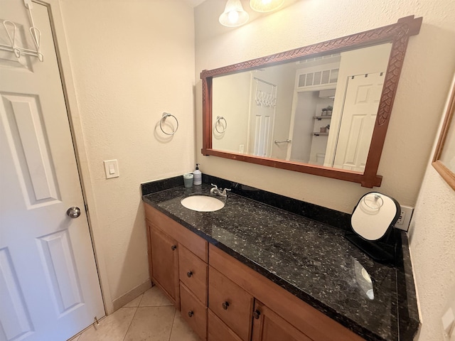 3660 Lower Honoapiilani Rd Unit 111, Lahaina, HI 96761 - bathroom featuring tile patterned flooring, vanity, and a textured wall