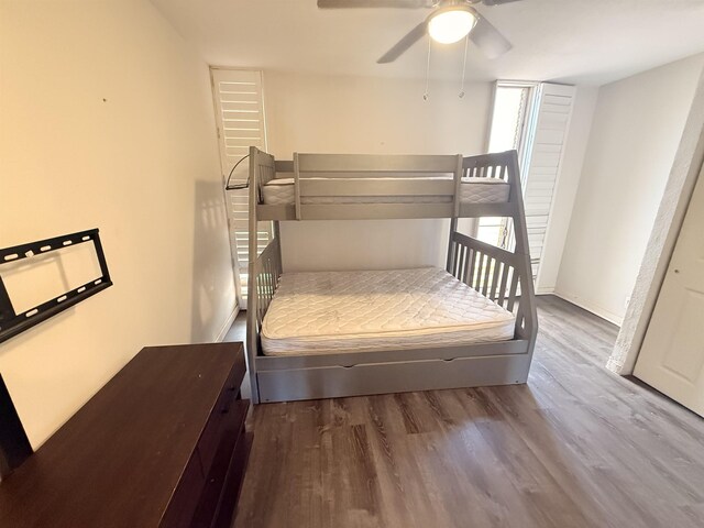 3660 Lower Honoapiilani Rd Unit 111, Lahaina, HI 96761 - bedroom with wood finished floors, ceiling fan, and baseboards