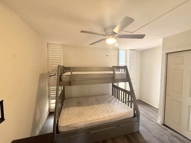 3660 Lower Honoapiilani Rd Unit 111, Lahaina, HI 96761 - bedroom with wood finished floors, baseboards, and ceiling fan