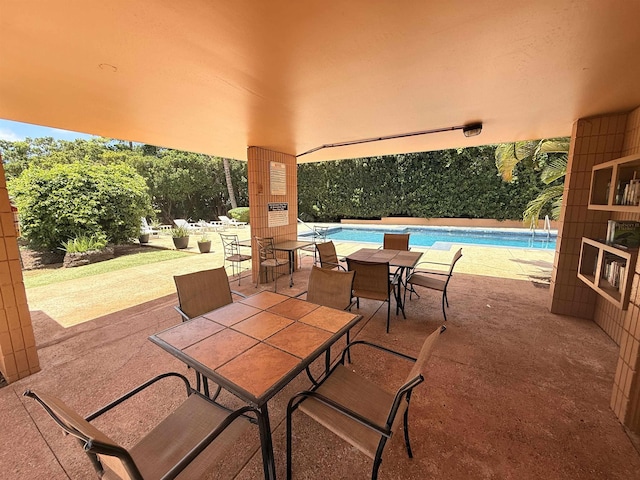 3660 Lower Honoapiilani Rd Unit 111, Lahaina, HI 96761 - view of patio featuring an outdoor pool and outdoor dining space