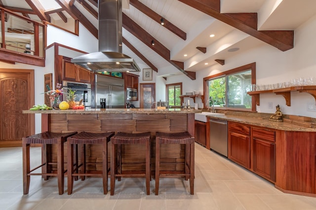kitchen with island range hood, open shelves, beam ceiling, a sink, and built in appliances